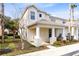 Two-story home with a front porch and landscaping at 1407 Retreat Cir, Clermont, FL 34714