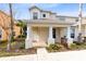 Two-story townhome with front porch and landscaping at 1407 Retreat Cir, Clermont, FL 34714