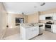 Kitchen with breakfast bar and view into Gathering room at 1407 Retreat Cir, Clermont, FL 34714