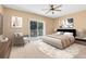 Main bedroom with access to private balcony at 1407 Retreat Cir, Clermont, FL 34714