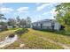 Spacious backyard with fire pit and shed at 1424 Sheridan Sw St, Winter Haven, FL 33880