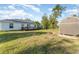 Large backyard with shed and fire pit at 1424 Sheridan Sw St, Winter Haven, FL 33880