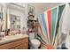 Bathroom with colorful shower curtain and updated vanity at 1424 Sheridan Sw St, Winter Haven, FL 33880