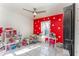 bedroom with red polka dot walls and playful decor at 1424 Sheridan Sw St, Winter Haven, FL 33880