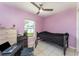 Small bedroom with single bed, dresser, and desk at 1424 Sheridan Sw St, Winter Haven, FL 33880