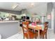 Kitchen with light green cabinets, breakfast bar, and dining area at 1424 Sheridan Sw St, Winter Haven, FL 33880