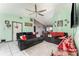 Living room with gray couches, ceiling fan, and tile floor at 1424 Sheridan Sw St, Winter Haven, FL 33880