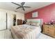 Spacious main bedroom with a comfortable bed and en-suite bathroom at 1424 Sheridan Sw St, Winter Haven, FL 33880