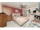 Main bedroom with queen bed and neutral color palette at 1424 Sheridan Sw St, Winter Haven, FL 33880