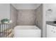 Soaking tub with grey tile surround at 150 E Robinson St # 3107, Orlando, FL 32801