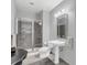 Bathroom with pedestal sink and shower at 150 E Robinson St # 3107, Orlando, FL 32801