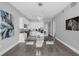 Bright dining area with glass table and chairs, adjacent to kitchen at 150 E Robinson St # 3107, Orlando, FL 32801