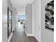 Modern condo hallway with hardwood floors and artwork at 150 E Robinson St # 3107, Orlando, FL 32801