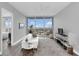 Living room with city views and comfortable seating at 150 E Robinson St # 3107, Orlando, FL 32801