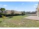 Large backyard with grassy lawn and patio at 1504 Oak Marsh Loop, Davenport, FL 33837