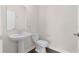 Clean and updated half bathroom with pedestal sink at 1504 Oak Marsh Loop, Davenport, FL 33837