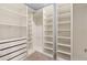 Large walk-in closet with ample shelving and drawers at 1504 Oak Marsh Loop, Davenport, FL 33837