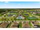 Aerial view of community amenities including pool, tennis courts, and playground at 15863 Burch Island Ct, Winter Garden, FL 34787