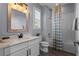 Clean bathroom with a white vanity, bathtub, and stylish shower curtain at 15863 Burch Island Ct, Winter Garden, FL 34787