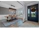 Elegant dining room with rustic wood table and chandelier at 15863 Burch Island Ct, Winter Garden, FL 34787