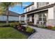 Welcoming front porch with rocking chairs and landscaping at 15863 Burch Island Ct, Winter Garden, FL 34787