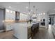 Modern kitchen with a large island, stainless steel appliances, and white cabinetry at 15863 Burch Island Ct, Winter Garden, FL 34787