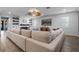 Open living area showcasing a comfortable sectional sofa and wood-look floors at 15863 Burch Island Ct, Winter Garden, FL 34787