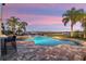 Resort-style pool and patio with sunset views at 15863 Burch Island Ct, Winter Garden, FL 34787