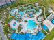 Resort-style pool with lazy river, water slides, and expansive sundeck at 1611 Kona Ln, Davenport, FL 33897