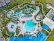 Resort-style pool with lazy river, water slides, and expansive sundeck at 1611 Kona Ln, Davenport, FL 33897