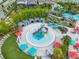 Resort-style pool with a splash area and plenty of lounge chairs at 1611 Kona Ln, Davenport, FL 33897