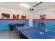 Garage game room with ping pong, air hockey, and foosball tables at 1611 Kona Ln, Davenport, FL 33897