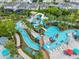 Aerial view of a relaxing lazy river winding through a resort-style pool area at 1611 Kona Ln, Davenport, FL 33897