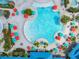 Large freeform pool with plenty of lounge chairs and umbrellas at 1611 Kona Ln, Davenport, FL 33897