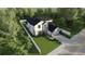 Aerial view of a modern white two-story home with a well-kept lawn and a white fence perimeter at 1700 Underwood Ave, St Cloud, FL 34771