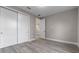 Bedroom featuring wood floors and a closet with sliding doors at 1700 Underwood Ave, St Cloud, FL 34771