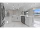 Bright kitchen features an island, stainless steel appliances, modern lighting and open floorplan at 1700 Underwood Ave, St Cloud, FL 34771