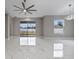 Open living area with slider doors, expansive windows, and modern ceiling fans and light fixtures at 1700 Underwood Ave, St Cloud, FL 34771