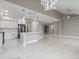 Spacious open floorplan with marble tile, an island kitchen, high ceilings and modern lighting at 1700 Underwood Ave, St Cloud, FL 34771