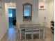 Dining area with a table and chairs, view into living room at 1904 Tohoqua Blvd, Kissimmee, FL 34744