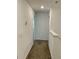 Upstairs hallway with carpet and access to bedrooms at 1904 Tohoqua Blvd, Kissimmee, FL 34744