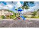 playground with slide and climbing structures at 1910 Summer Club Dr # 110, Oviedo, FL 32765