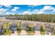 Community view showing several houses and landscape at 1991 Hemingway Cir, Groveland, FL 34736