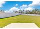 Large backyard with grassy area and patio at 1991 Hemingway Cir, Groveland, FL 34736