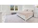 Main bedroom with large bed and plenty of floor space at 1991 Hemingway Cir, Groveland, FL 34736