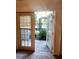 French doors leading to a private patio with pool view at 202 E South St # 1050, Orlando, FL 32801