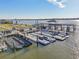 Community dock with multiple boat slips and floating docks at 2100 N Peninsula Ave # 1030, New Smyrna Beach, FL 32169