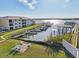 Aerial view of waterfront property with boats and docks at 2100 N Peninsula Ave # 1030, New Smyrna Beach, FL 32169