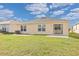 House exterior view with grassy backyard at 213 Lake Lucerne Way, Winter Haven, FL 33881