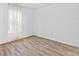 Bright bedroom featuring wood-look floors at 213 Lake Lucerne Way, Winter Haven, FL 33881